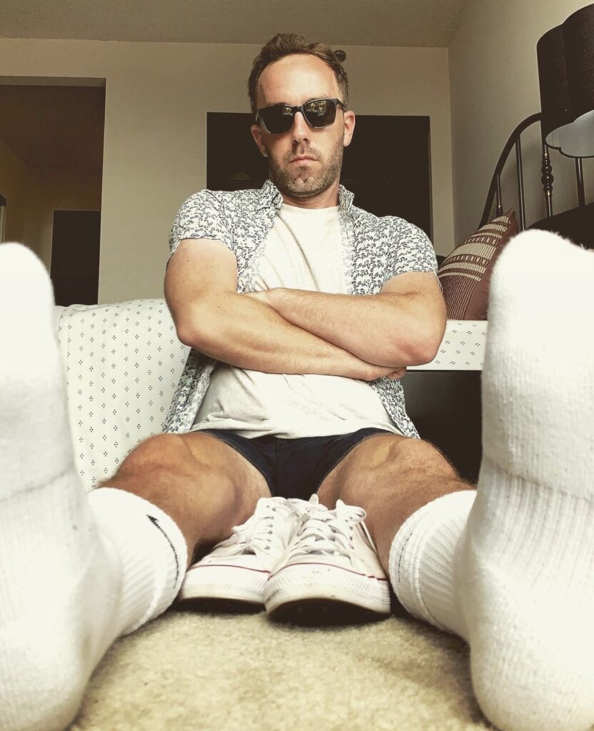 Danielryanbarry in white Nike crew socks out of white Converse sneakers